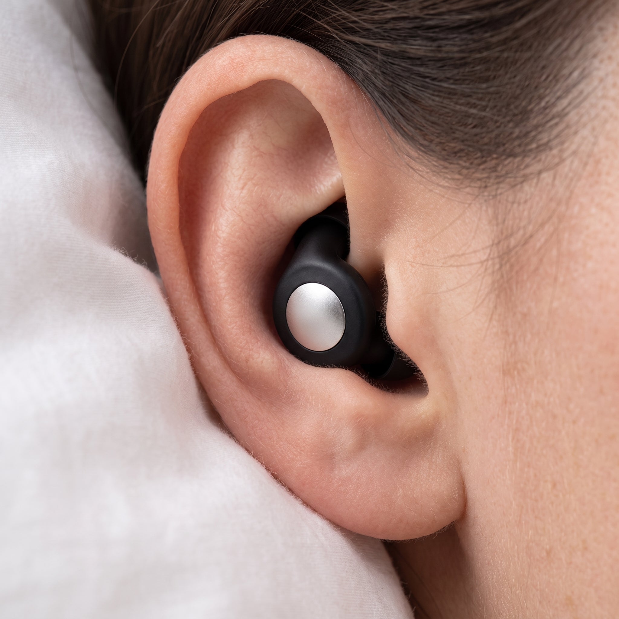Close-up of RISR Loop earplug fitted in ear